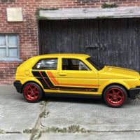 Custom Hot Wheels VW Volkswagen Golf MK2 In Yellow, Black and Orange With Red 6 Spoke Studded Wheels and Rubber Tires