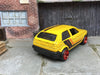 Custom Hot Wheels VW Volkswagen Golf MK2 In Yellow, Black and Orange With Red 6 Spoke Studded Wheels and Rubber Tires