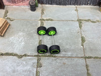 Alternate view of four 12mm black-and-green racing 5-spoke wheels with black rubber tires