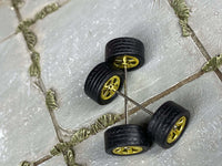 Close view of gold 5-star wheels with rubber tires