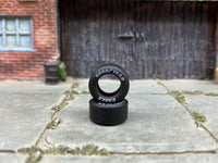 Two 12mm Goodyear Eagle-lettered drag slick rubber tires shown without wheels