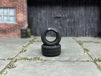 Two 13mm Hoosier-lettered drag slick rubber tires, view 1