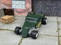 Custom Matchbox 1935 Ford pickup hot rod in satin green, front three-quarter view showing the grille and chrome mag wheels