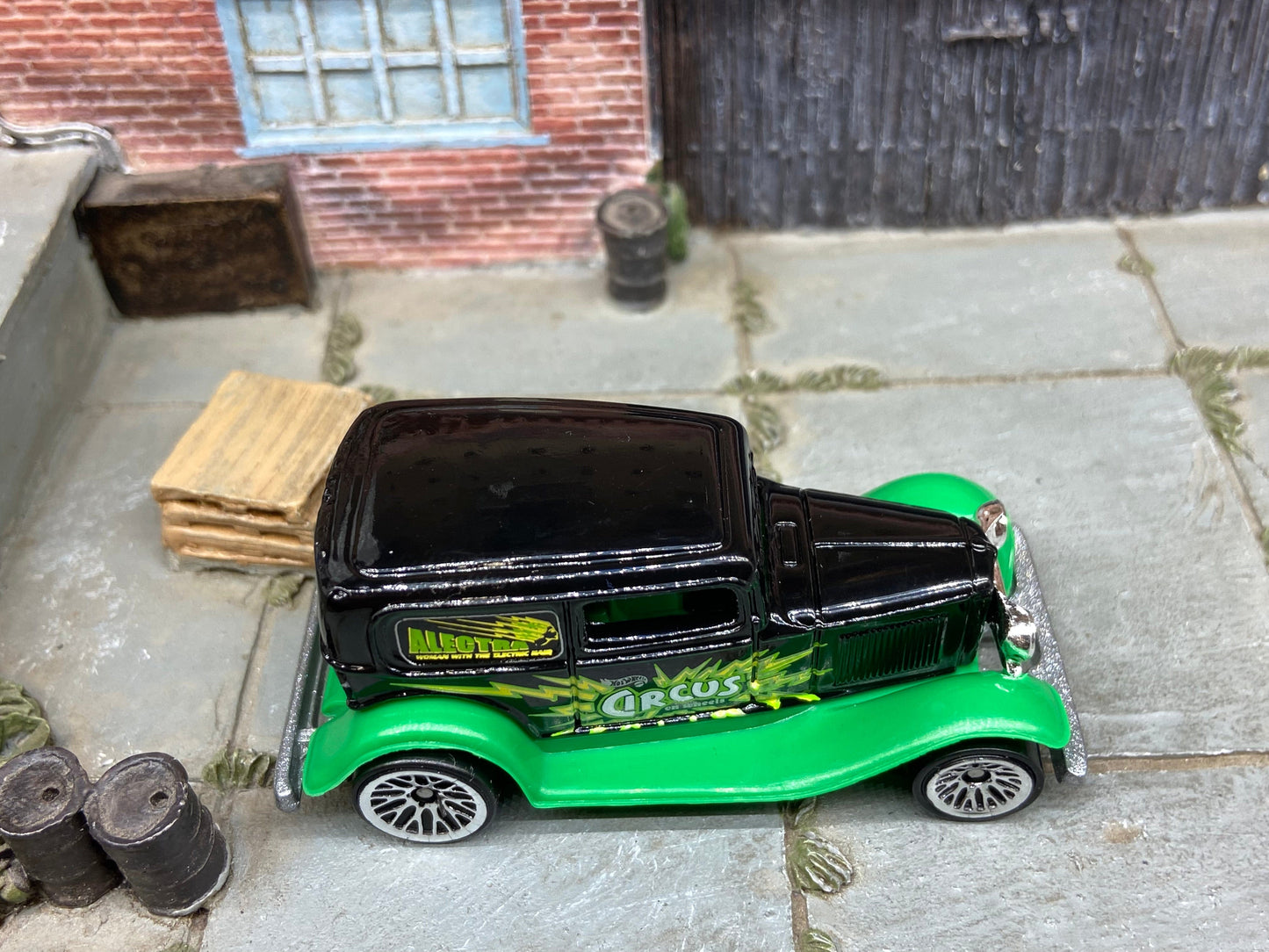 Loose Hot Wheels Ford Model A Sedan Dressed in Black and Green