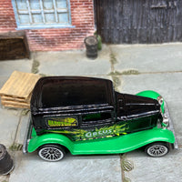 Loose Hot Wheels 1932 Ford Model A Sedan Dressed in Black and Green