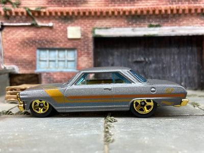 Loose Hot Wheels 1963 Chevy II Nova Dressed in Satin Gray and Gold 51st Anniversary Livery