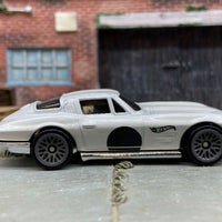 Loose Hot Wheels 1964 Chevy Corvette Dressed in White and Black