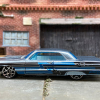 Loose Hot Wheels 1964 Chevy Impala Dressed in Light Blue with Graphics