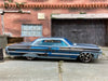 Loose Hot Wheels 1964 Chevy Impala Dressed in Light Blue with Graphics