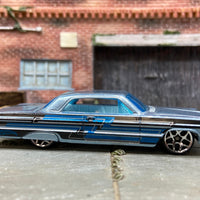 Loose Hot Wheels 1964 Chevy Impala Dressed in Light Blue with Graphics