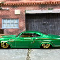 Loose Hot Wheels 1965 Chevy Impala Dressed in Green and Gold