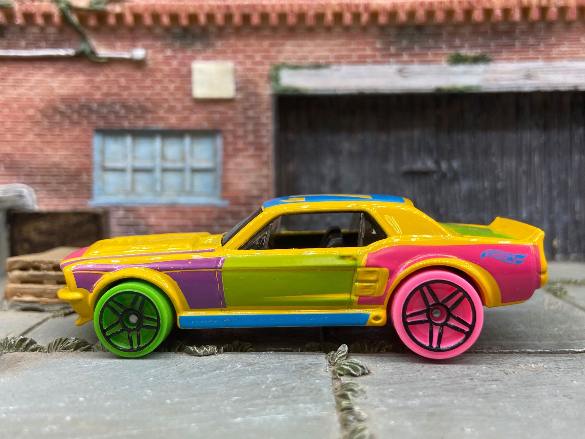 Loose Hot Wheels 1967 Ford Mustang GT Dressed in Yellow, Pink and Blue Art Car Livery
