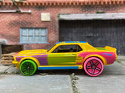 Loose Hot Wheels 1967 Ford Mustang GT Dressed in Yellow, Pink and Blue Art Car Livery