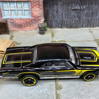 Loose Hot Wheels 1967 Pontiac GTO Dressed in Black and Yellow