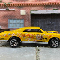 Loose Hot Wheels 1967 Pontiac GTO Dressed in Yellow Flower Power Skull and Flames Livery