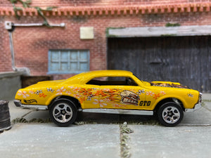 Loose Hot Wheels 1967 Pontiac GTO Dressed in Yellow Flower Power Skull and Flames Livery