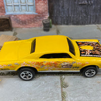 Loose Hot Wheels 1967 Pontiac GTO Dressed in Yellow Flower Power Skull and Flames Livery