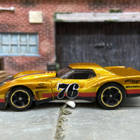 Loose Hot Wheels 1976 Chevy Corvette Greenwood Dressed in Gold, Black and Red 76