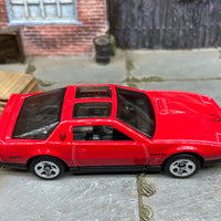 Loose Hot Wheels 1984 Pontiac Firebird in Red and Black