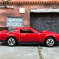 Loose Hot Wheels 1984 Pontiac Firebird in Red and Black