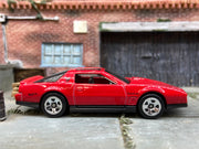 Loose Hot Wheels 1984 Pontiac Firebird in Red and Black