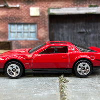 Loose Hot Wheels 1984 Pontiac Firebird in Red and Black