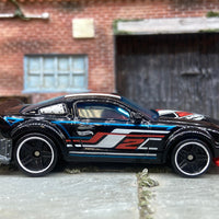 Loose Hot Wheels 2005 Ford Mustang Race Car Dressed in Black, White and Red