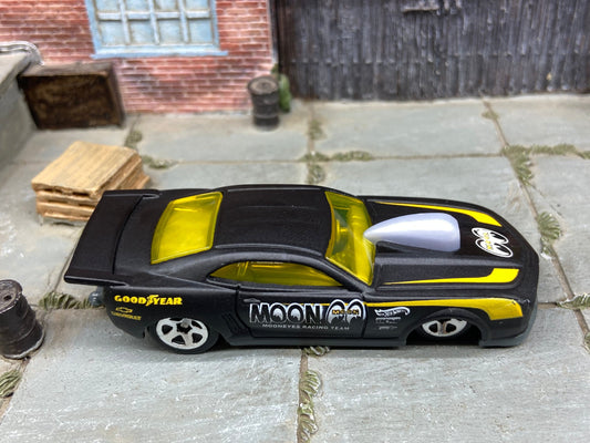 Loose Hot Wheels 2010 Pro-Stock Chevy Camaro Drag Car Dressed in Satin Black and Yellow Mooneyes Livery