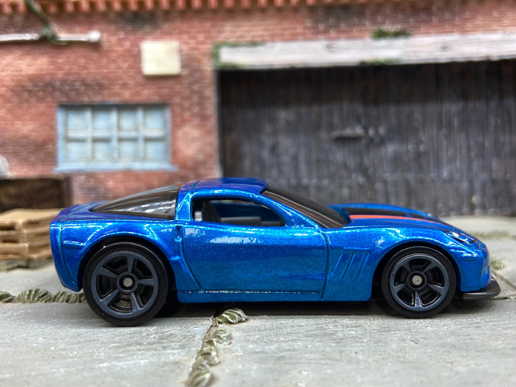 Loose Hot Wheels 2011 Chevy Corvette Grand Sport Dressed in Blue, Black and Red