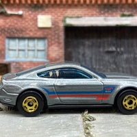 Loose Hot Wheels 2015 Ford Mustang GT Dressed in Silver, Blue and Red