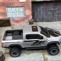 Loose Hot Wheels 2017 Ford F150 Raptor 4X4 Truck Dressed In Silver and Black Raptor Livery