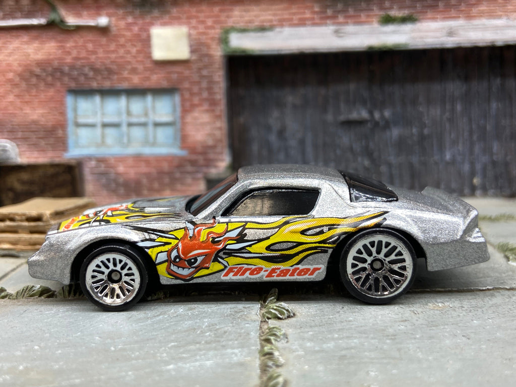 Loose Hot Wheels Camaro Z28 Dressed in Silver Fire Eater Flame Livery