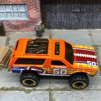 Loose Hot Wheels Chevy Blazer 4×4 - Orange Football 50