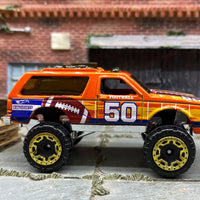 Loose Hot Wheels Chevy Blazer 4×4 - Orange Football 50