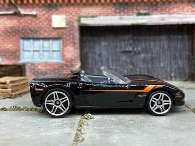 Loose Hot Wheels Chevy Corvette C6 Convertible Dressed in Black and Orange