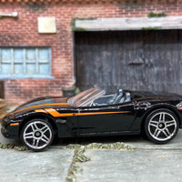 Loose Hot Wheels Chevy Corvette C6 Convertible Dressed in Black and Orange