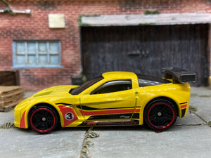 Loose Hot Wheels Chevy Corvette C6-R Race Car Dressed in Yellow, Red and Black 3