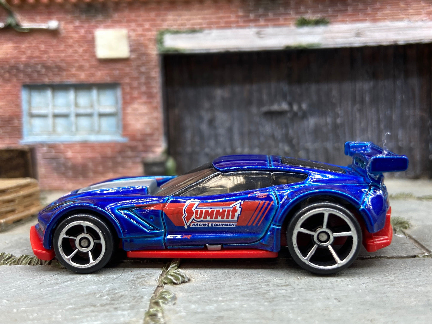 Loose Hot Wheels Chevy Corvette C7-R Race Car Dressed in Blue and Red Summit Racing