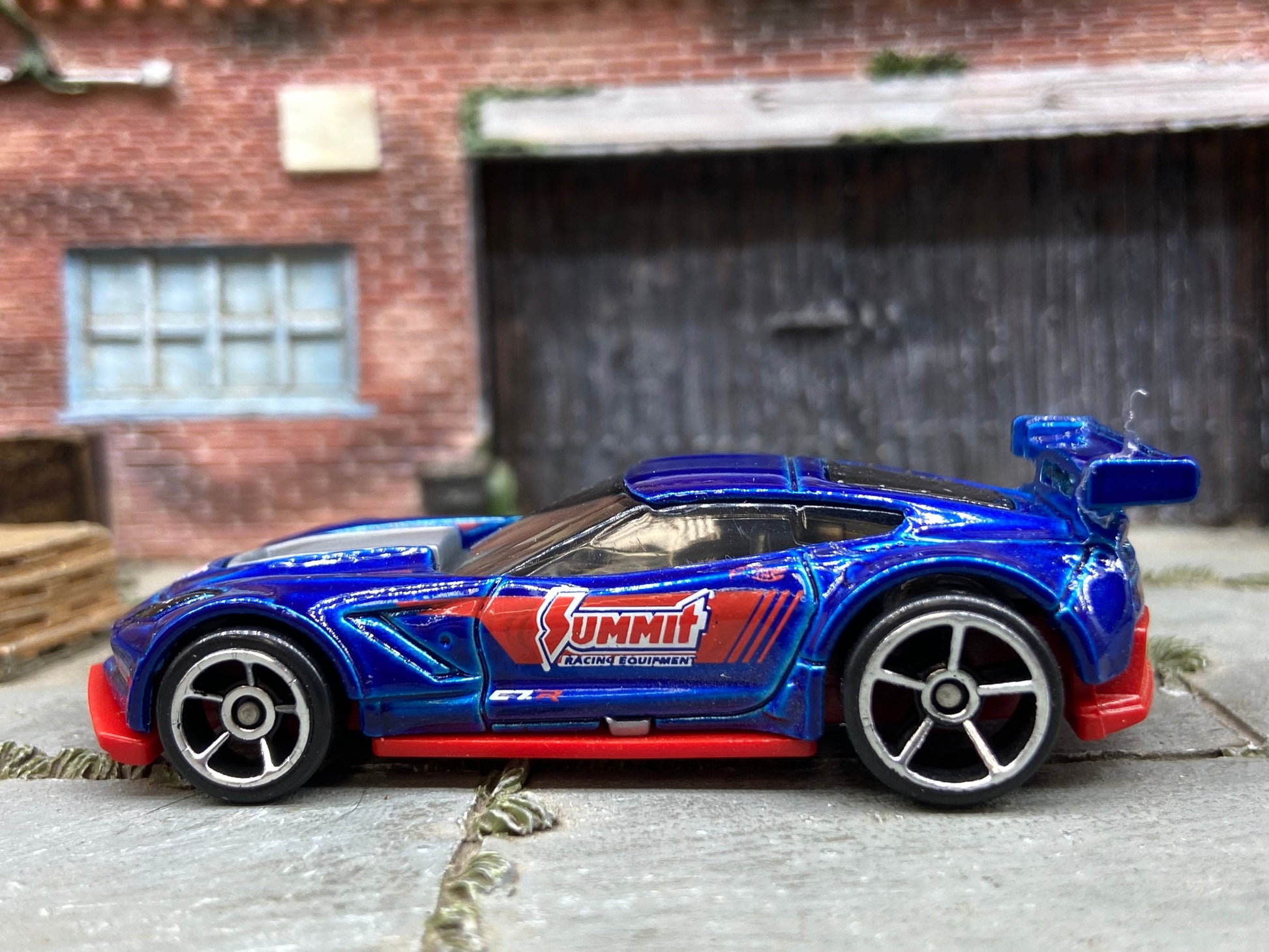 Loose Hot Wheels Chevy Corvette C7-R Race Car Dressed in Blue and Red Summit Racing