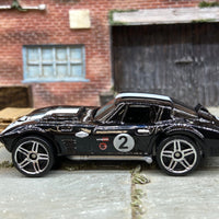 Loose Hot Wheels Chevy Corvette Grand Sport Dressed in Black and Gray