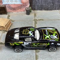 Loose Hot Wheels Chevy Corvette Stingray Dressed in Black and Green Extreme Rides Livery