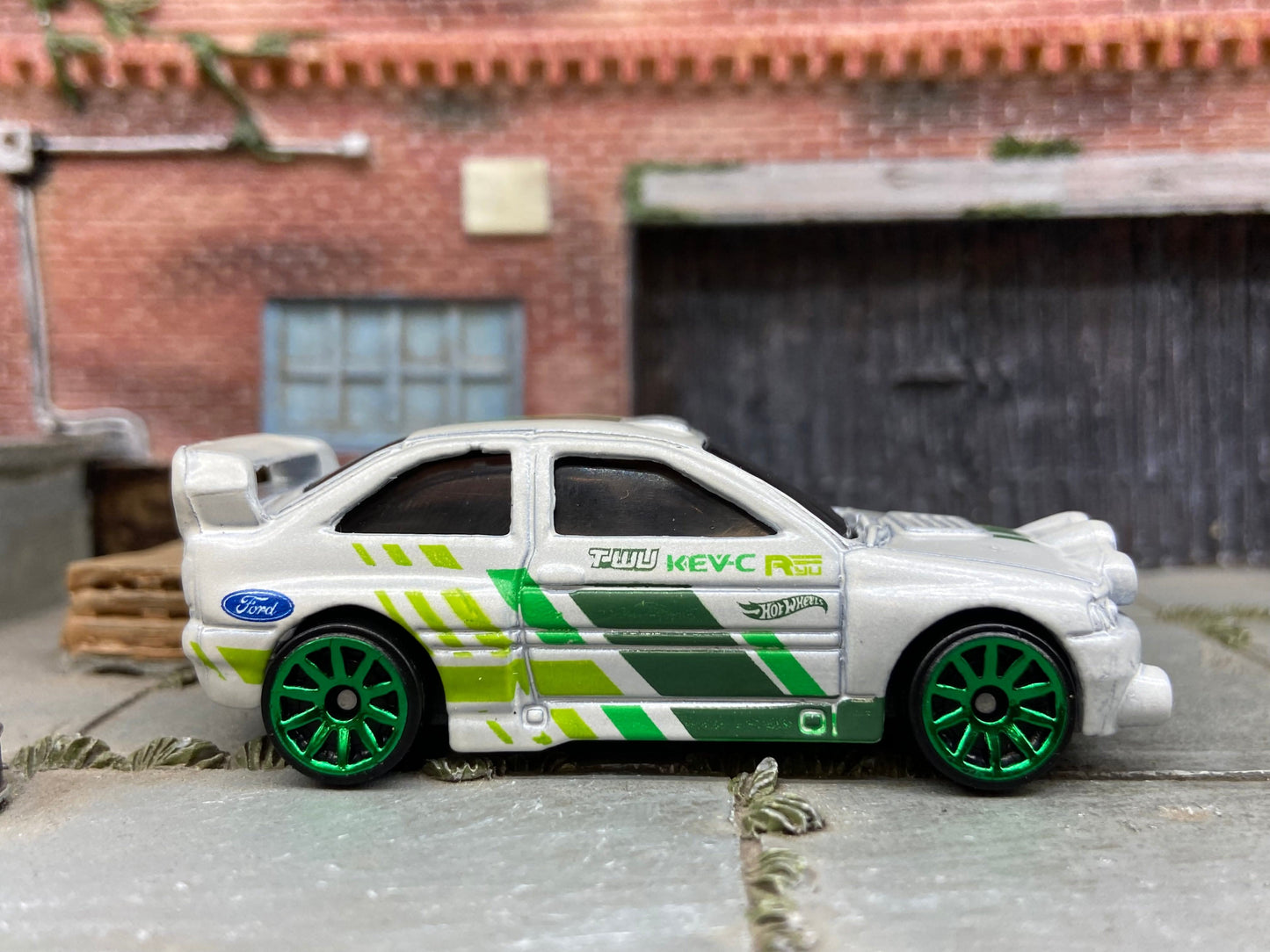 Loose Hot Wheels Ford Escort Rally Dressed in White and Green Race Livery