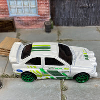 Loose Hot Wheels Ford Escort Rally Dressed in White and Green Race Livery