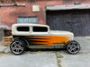 Loose Hot Wheels Ford Model A Sedan Midnight Otto Dressed in Pearl White, Orange and Black