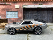 Loose Hot Wheels Ford Mustang Mach 1 Dressed in Silver with Black and Orange Scallops