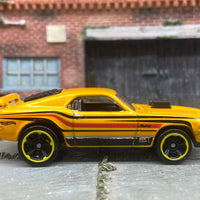Loose Hot Wheels Ford Mustang Mach 1 Dressed in Yellow, Orange and Black