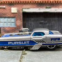 Loose Hot Wheels Nash Metrorail Drag Car Dressed in Silver, Black and Blue Pursuit Livery