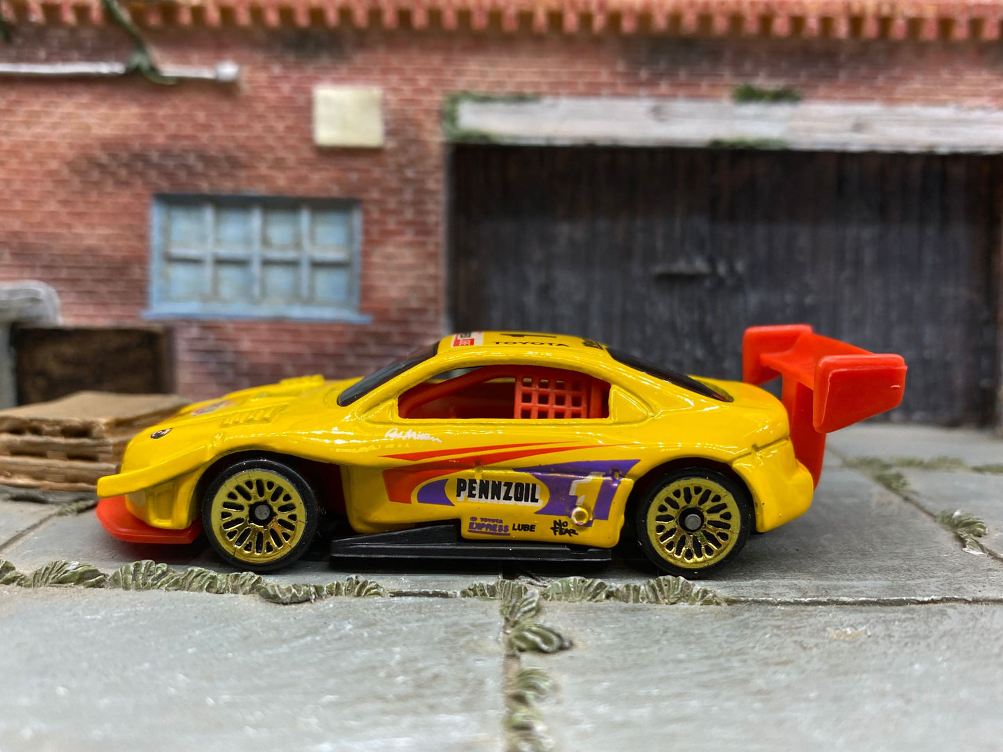 Loose Hot Wheels Pikes Peak Toyota Celica Race Car - Penzoil Yellow