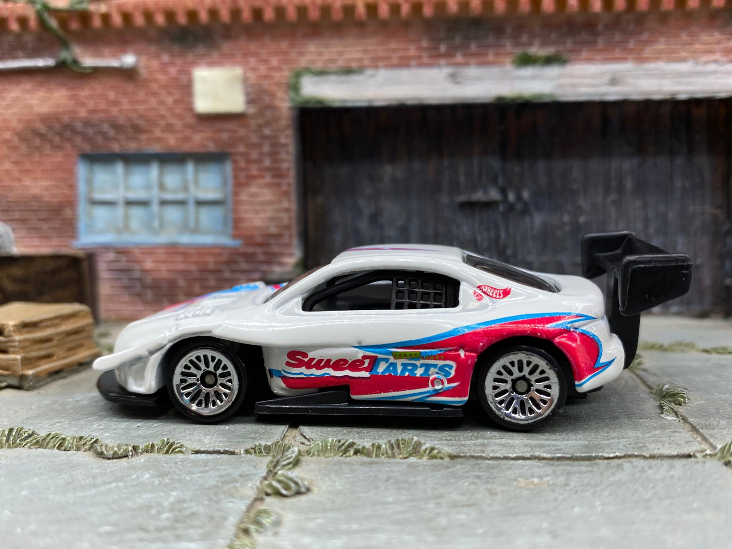 Loose Hot Wheels Pikes Peak Toyota Celica Race Car - White, Pink and Blue SweetTarts