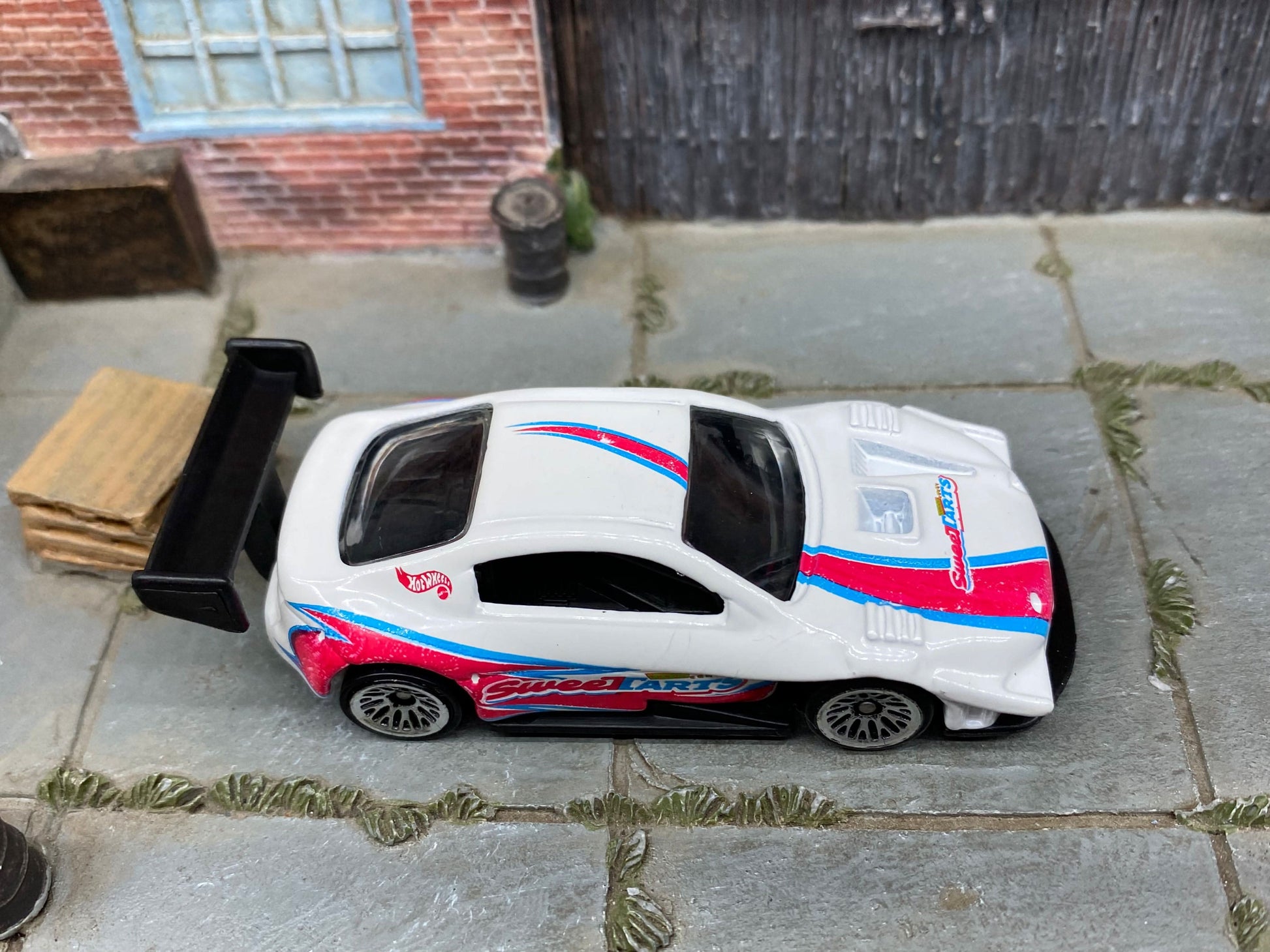 Loose Hot Wheels Pikes Peak Toyota Celica Race Car - White, Pink and Blue SweetTarts